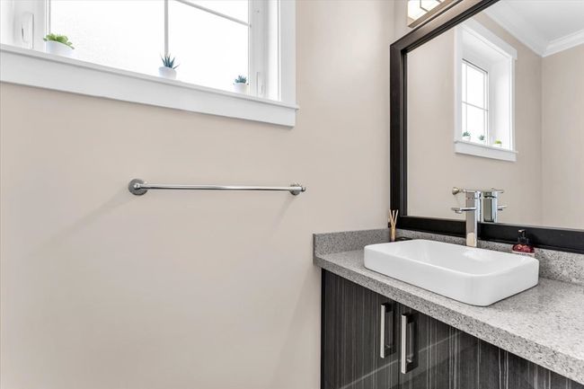 Bathroom with crown molding and vanity | Image 11