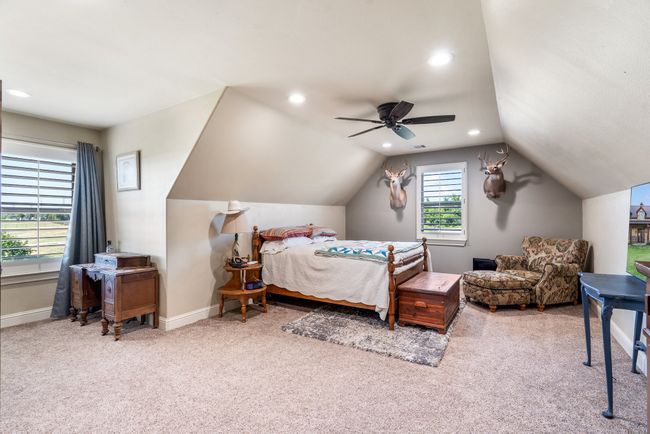 Bedroom with carpet flooring, lofted ceiling, recessed lighting, and a ceiling fan | Image 28