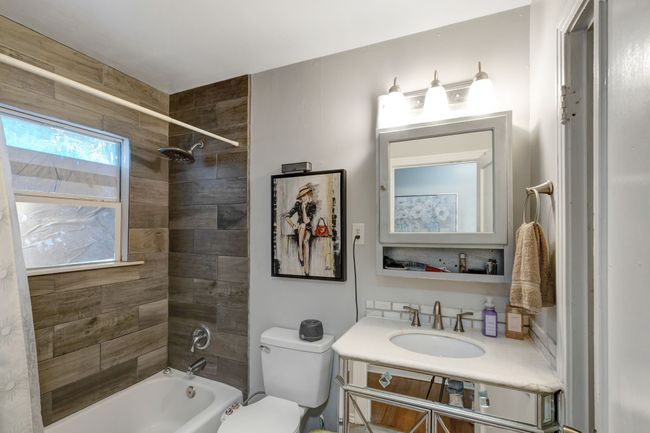 Full bathroom with vanity, toilet, and tiled shower / bath | Image 14