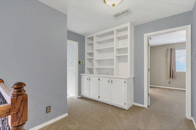 Hall featuring light carpet | Image 24