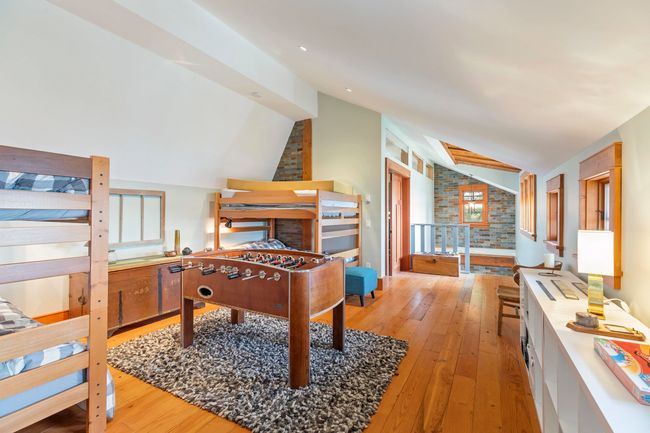 Bedroom with lofted ceiling and wood-type flooring | Image 23
