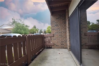 Balcony at dusk with a patio area | Image 2