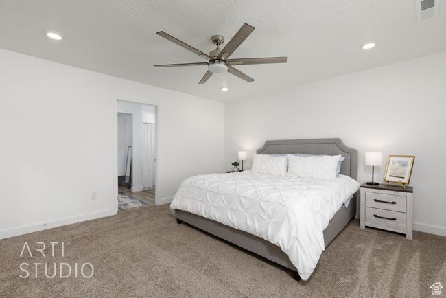 Bedroom featuring carpet, visible vents, recessed lighting, and baseboards | Image 19