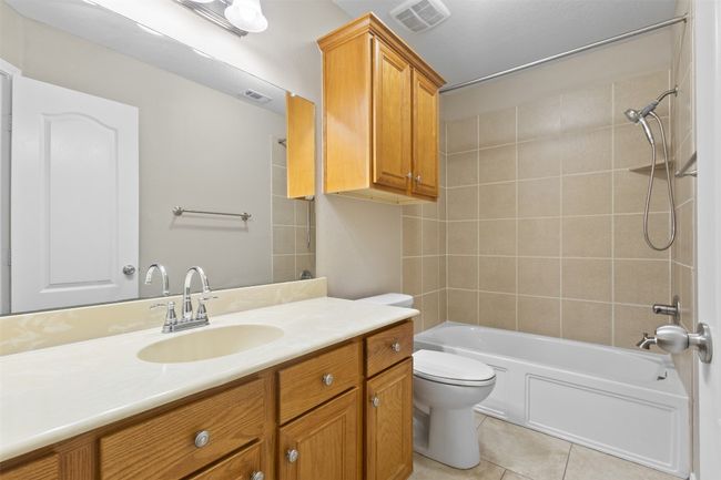 Hall bathroom featuring vanity, and shower / bathtub combination | Image 20