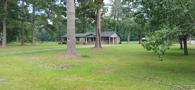 Single story home with a front yard and a porch | Image 11