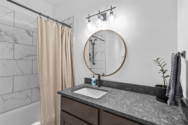 Bathroom with shower / bath combo with shower curtain and vanity | Image 37