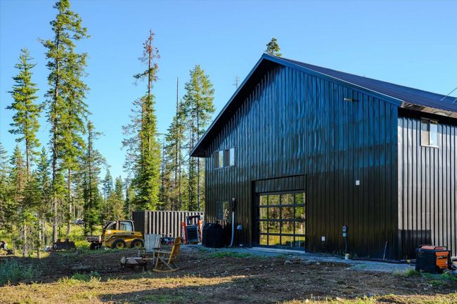 View of side of home with an outdoor structure, board and batten siding, and an outbuilding | Image 67