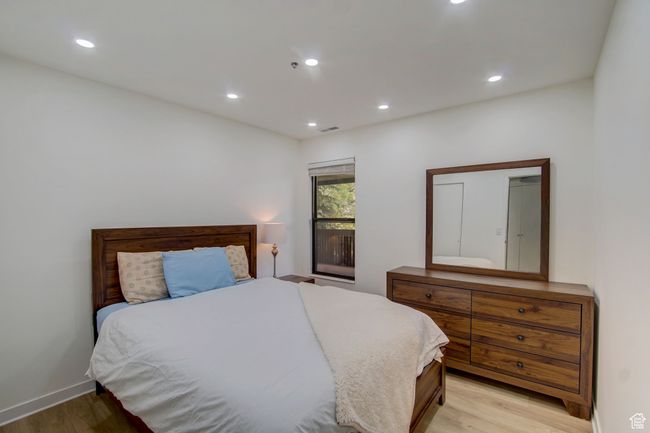 Bedroom featuring light wood-type flooring | Image 13