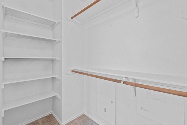 Walk in closet featuring carpet | Image 22