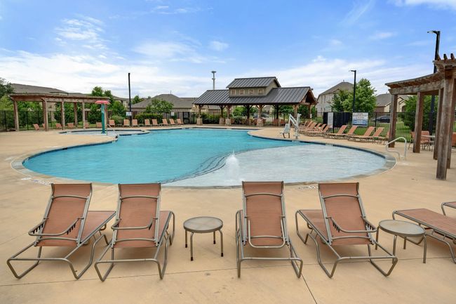 Community pool with a pergola and a patio area | Image 37