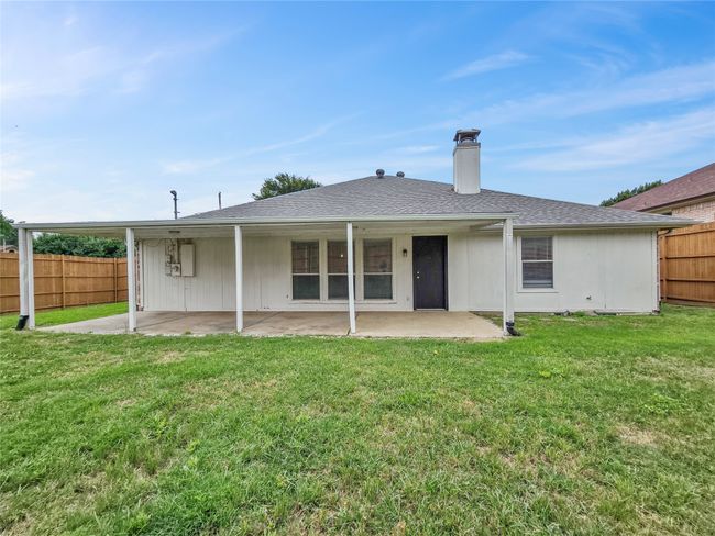 Back of house with a patio area and a chimney | Image 14