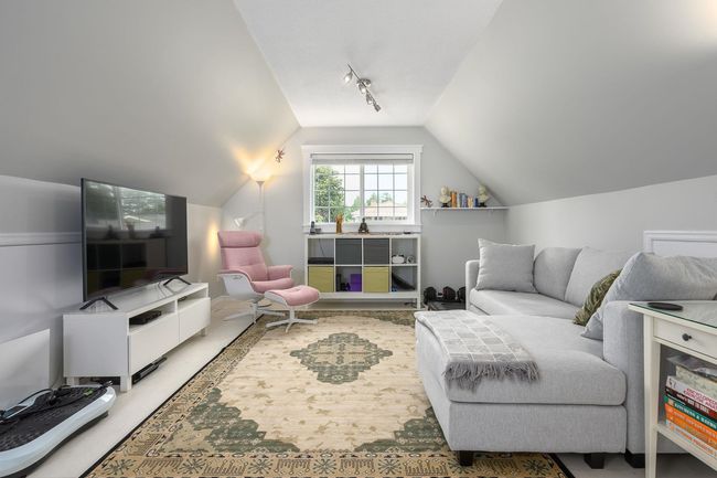 Living area with vaulted ceiling and track lighting | Image 19
