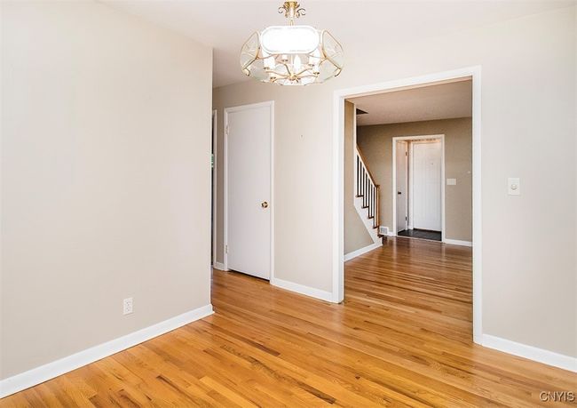 Looking from the formal dining room into the living room... | Image 12