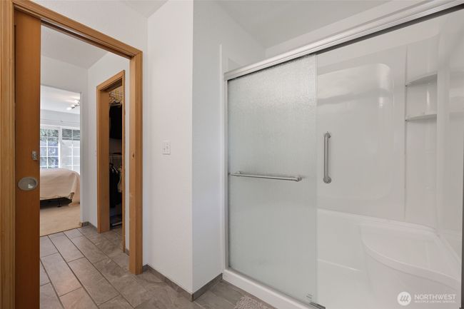 Nice walk-in shower with bench for comfort. | Image 31
