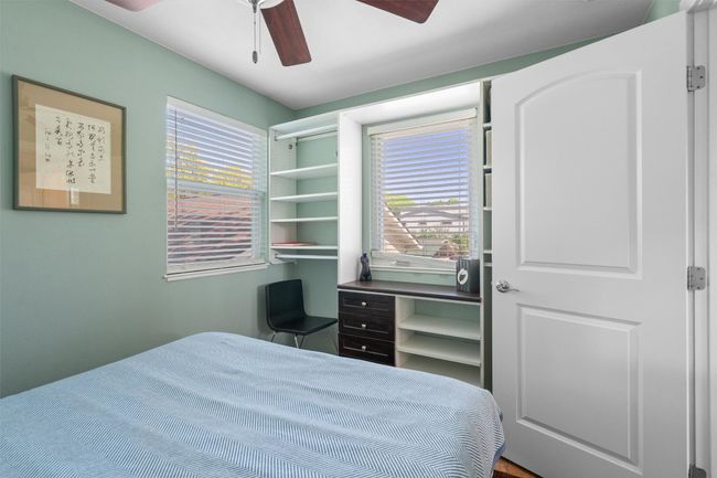 Bedroom featuring ceiling fan | Image 33