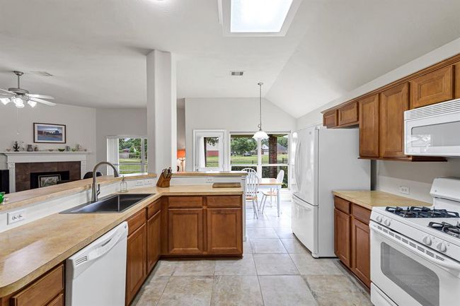 Fantastic kitchen opens to the living room and breakfast room. | Image 11