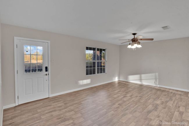 Entrance foyer with ceiling fan and light wood-type flooring | Image 8