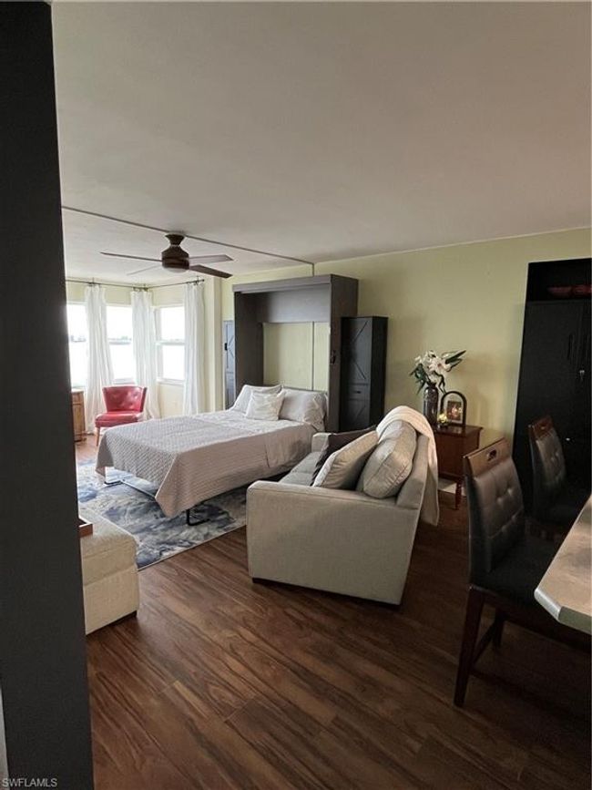 Murphy bed folded down in living room | Image 4