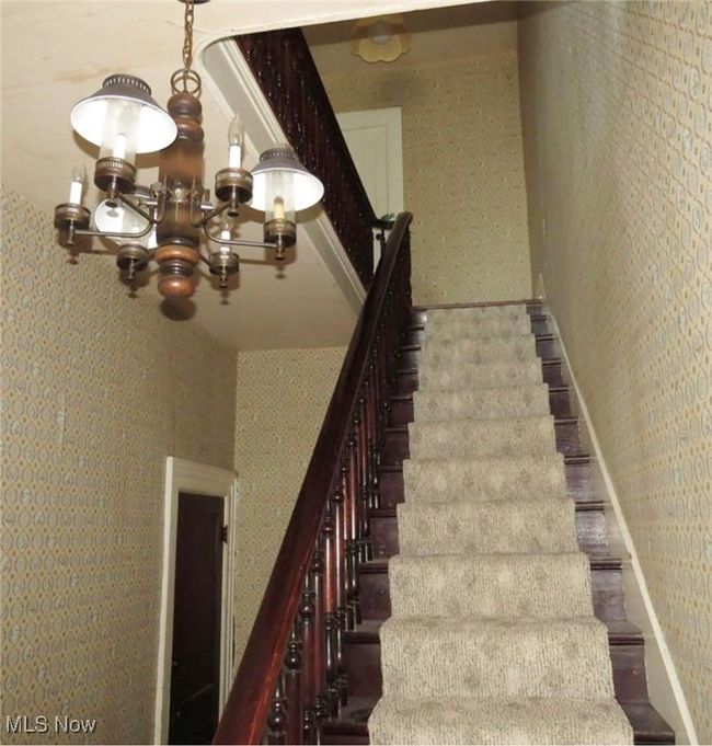 Staircase with a notable chandelier | Image 5