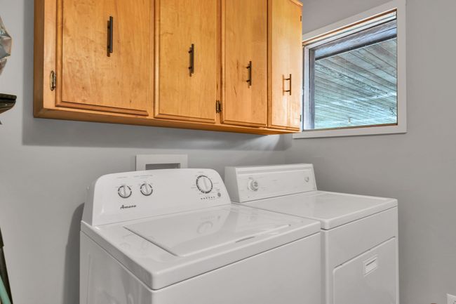 utility room has a pantry and extra shelving | Image 29