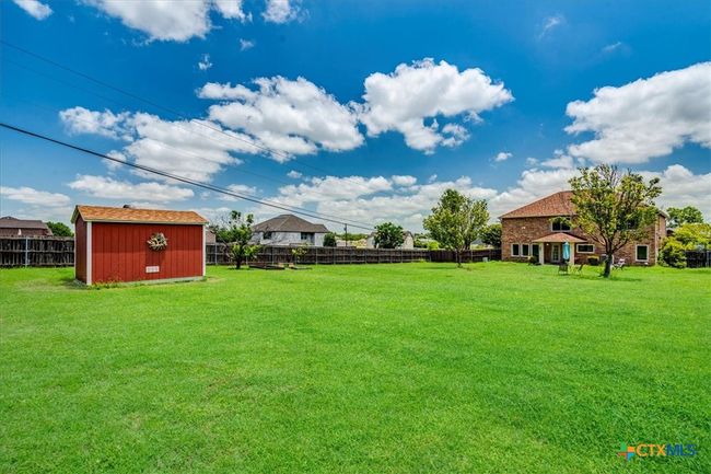 .5 acre backyard with storage shed | Image 5