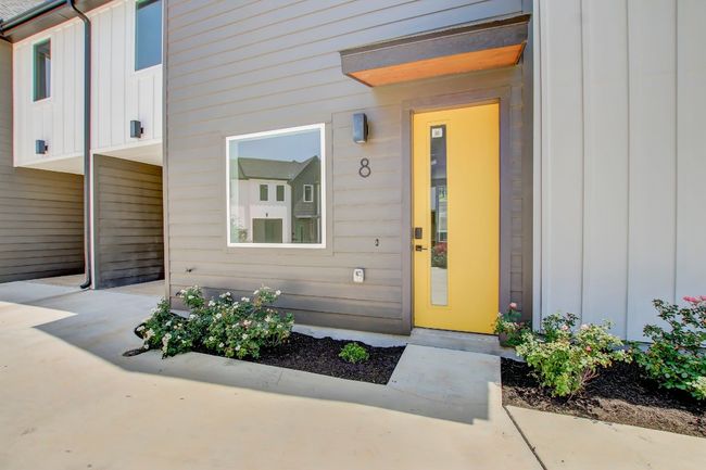 View of exterior entry with board and batten siding | Image 32