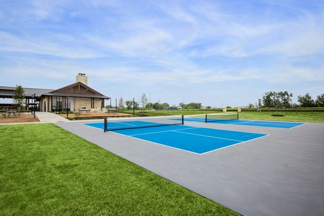 View of tennis court with a lawn and a gazebo | Image 33