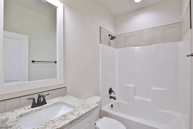 Full bath featuring vanity and shower / washtub combination | Image 21