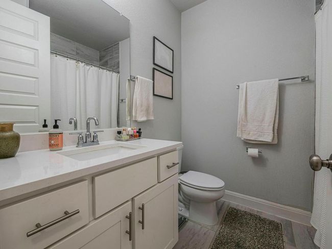 Bathroom with vanity and a shower with curtain | Image 19