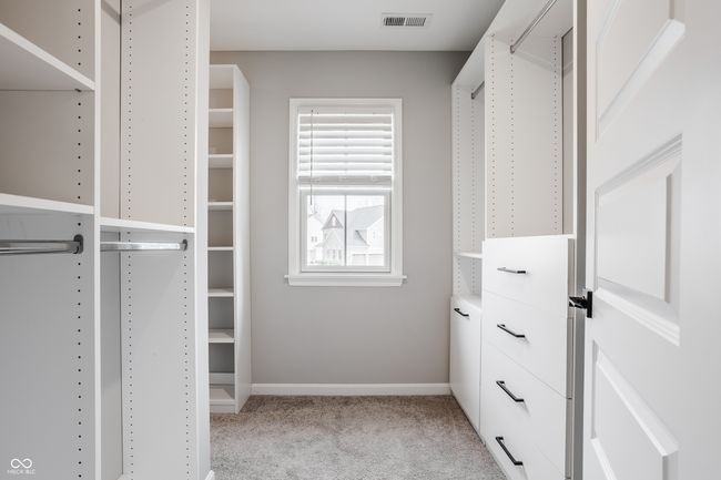 Custom Primary bedroom closet is so large and designed to keep all of your things organized. | Image 39