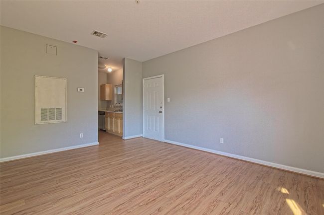 Unfurnished room featuring light wood finished floors and baseboards | Image 15