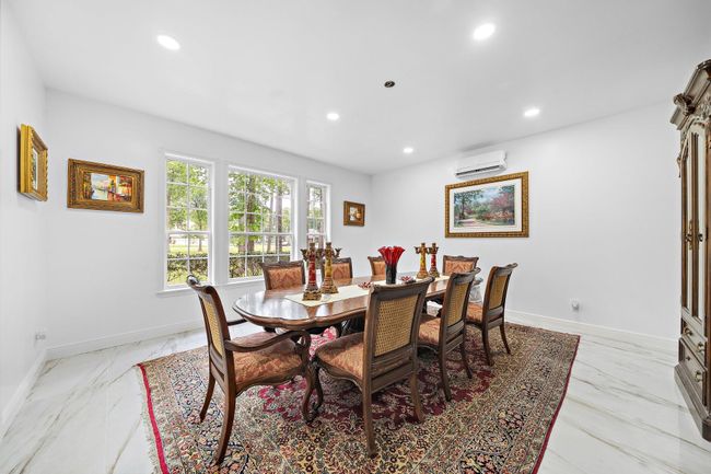 Bright dining room with large windows and ample space | Image 16