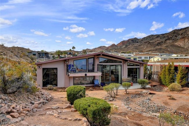 Back of property featuring stucco siding and a mountain view | Image 78