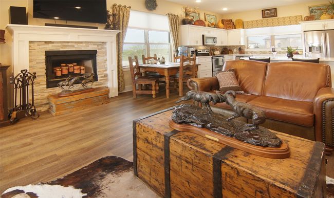 Living area featuring wood finished floors, recessed lighting, and a fireplace | Image 4