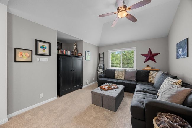 Upstairs game/family room separating Primary bedroom and secondary bedrooms | Image 28