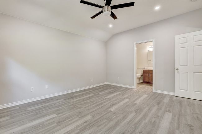 Primary bedroom with ensuite bathroom and new ceiling fan | Image 17