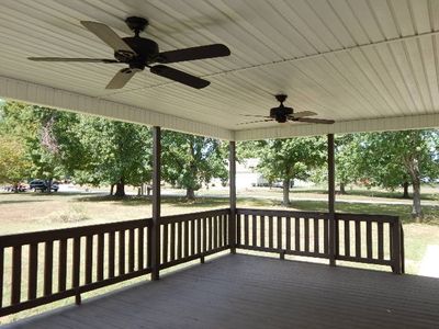 This beautiful covered deck with fans is awaiting your "sit a spell" time. Ceiling fans are new and has had deck newly stained | Image 2