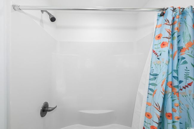Full bath featuring a shower with shower curtain | Image 14