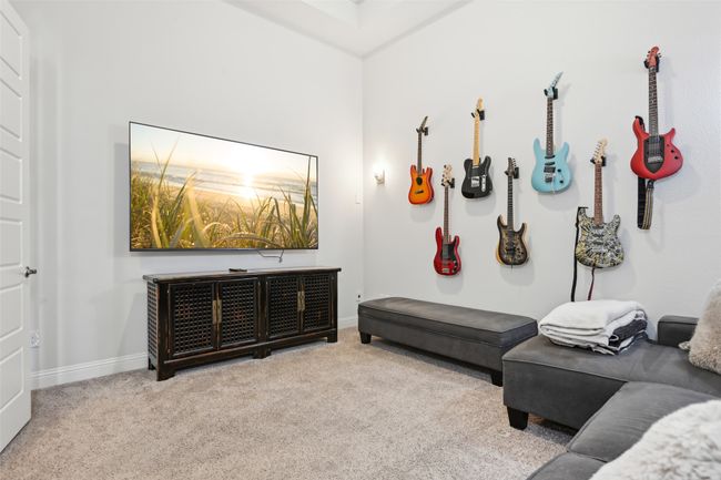 Carpeted living area with baseboards | Image 30