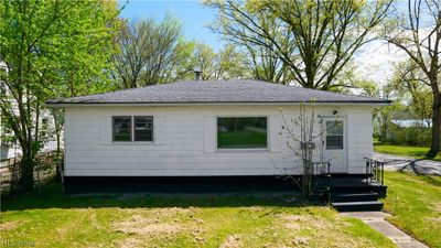 Back of house with a lawn | Image 1