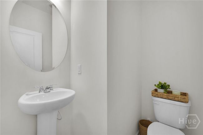 Quaint half bath on the main floor tucked away in the hall. | Image 28