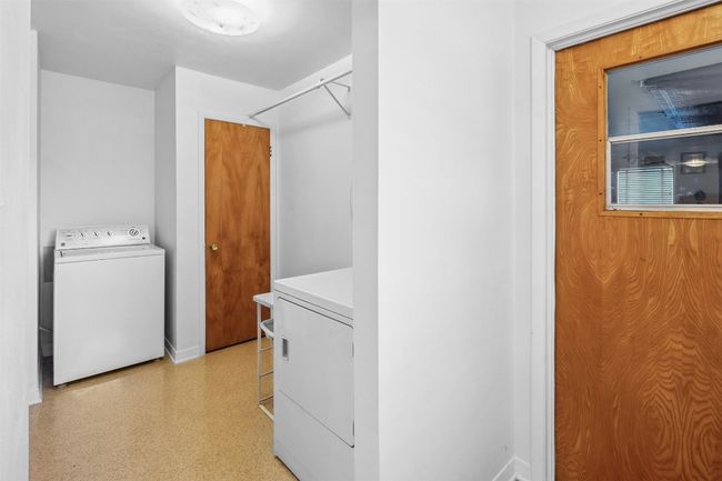 Laundry room featuring baseboards, light floors, and washer / clothes dryer | Image 19