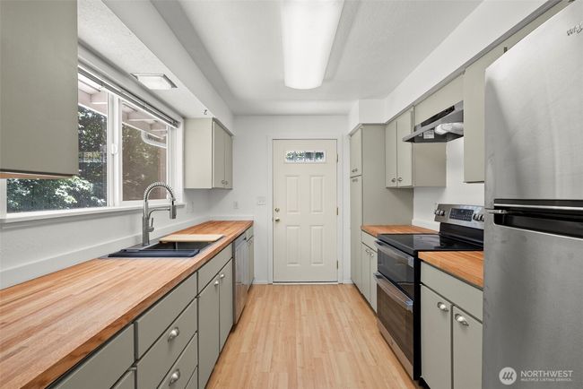 Beautiful renovated kitchen with access to the wrap around porch | Image 5