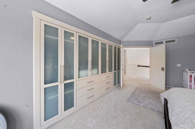Lovely built-in wall of cabinets | Image 51