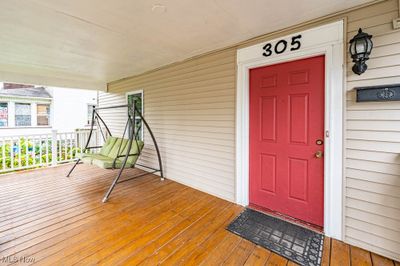 Entrance to property featuring covered porch. | Image 3