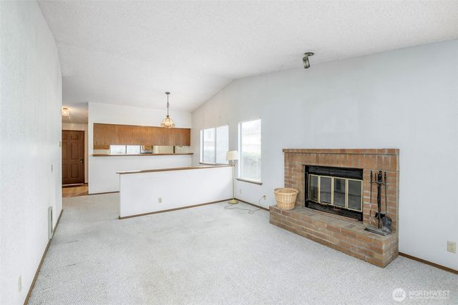 Wood-burning fireplace in the living room | Image 8