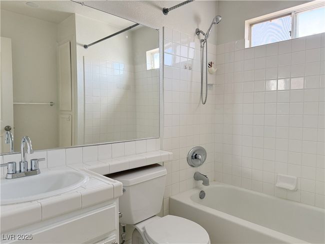 Bathroom featuring toilet, vanity, and washtub / shower​​‌​​​​‌​​‌‌​‌‌​​​‌‌​​‌‌​‌​​​​​‌ combination | Image 38
