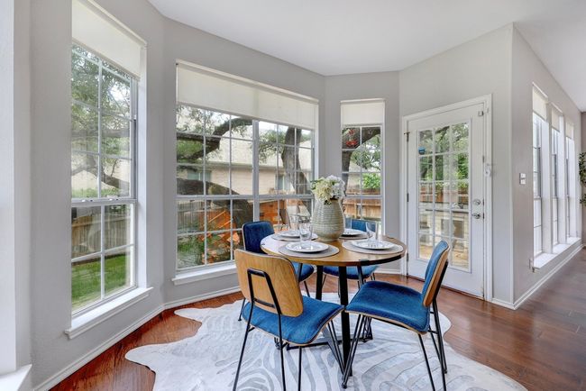 Dining room with plenty of natural light, wood finished floors, and baseboards | Image 19