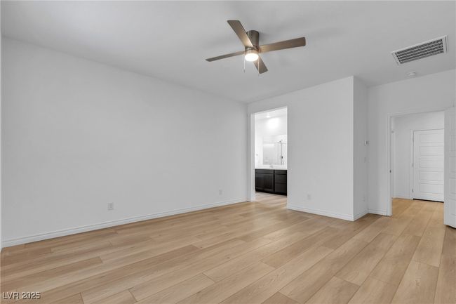 Spare room with a ceiling fan, light wood finished floors, and baseboards | Image 23