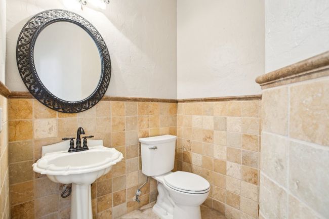 Immaculately maintained bathrooms with modern updates throughout. | Image 15